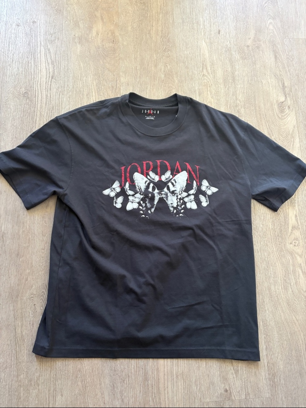 Jordan Black Short-Sleeve Tee with Red Logo and White Butterfly Graphic